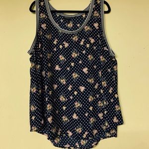Torrid floral sleeveless blouse.